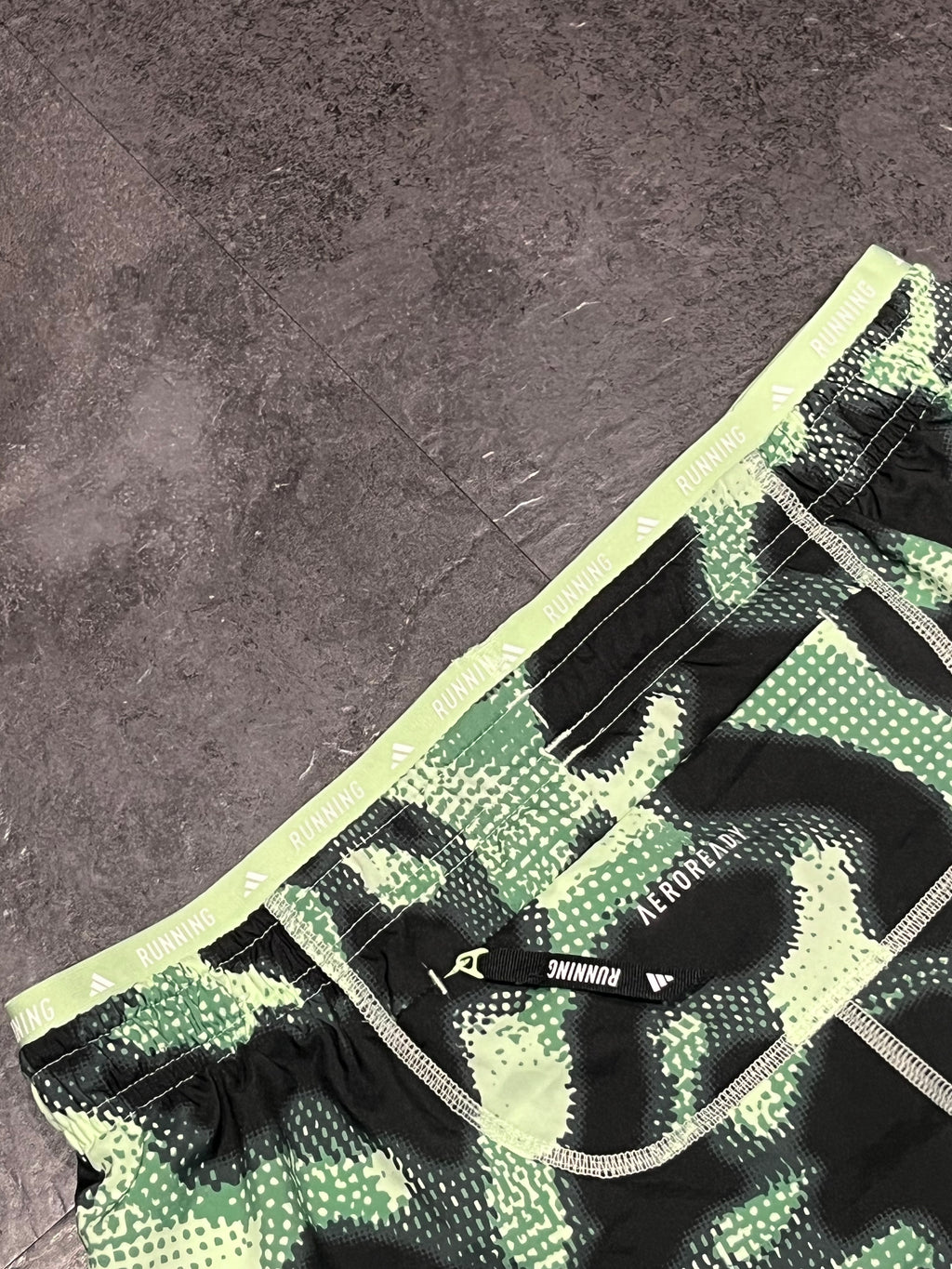 Striking Green Adidas Men’s “Own The Run” 3 Stripe 7” Running Shorts