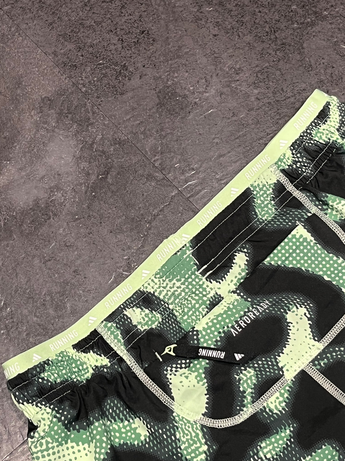 Striking Green Adidas Men’s “Own The Run” 3 Stripe 7” Running Shorts
