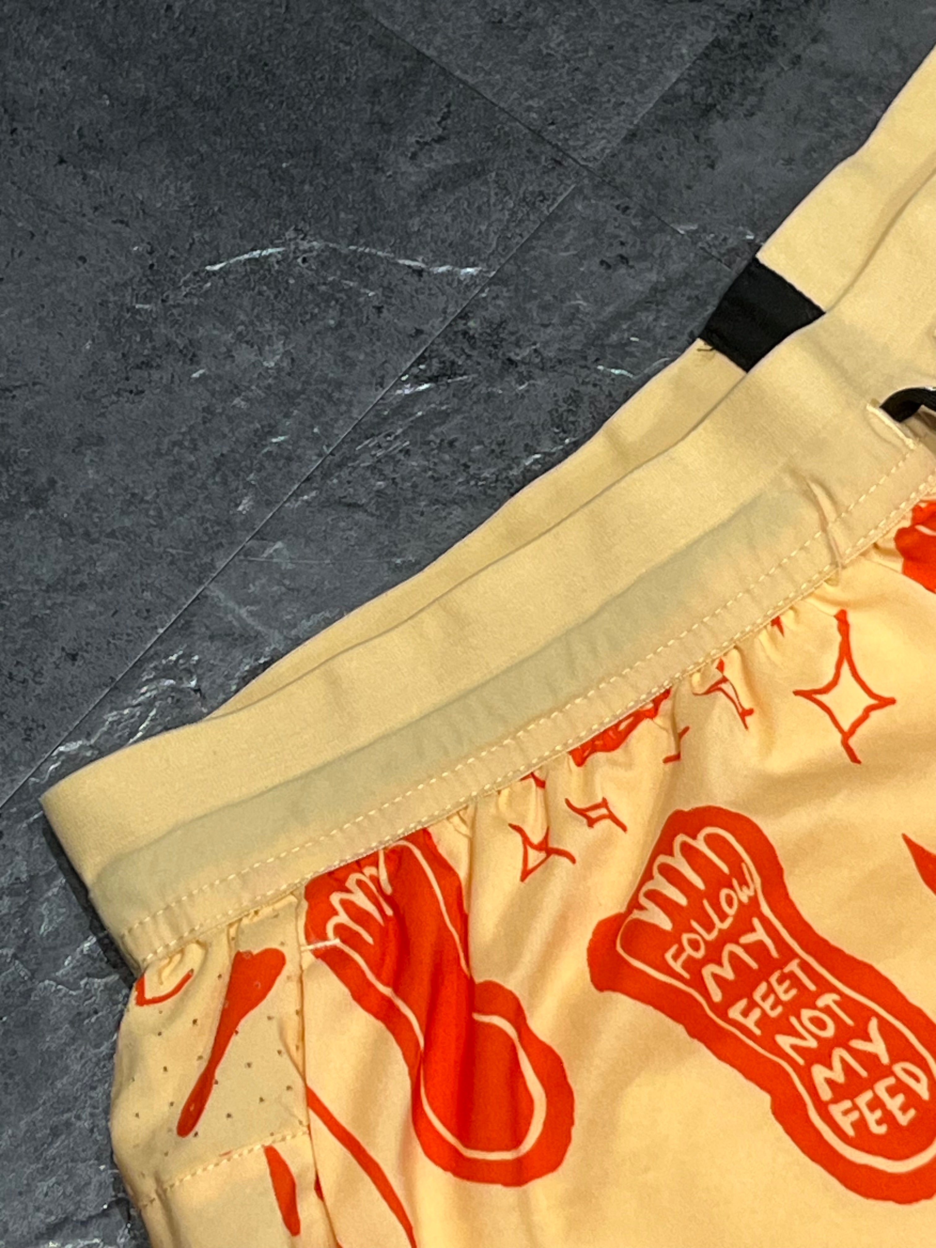 Yellow/Orange Nike A.I.R Nathan Bell Men’s Dri Fit Flex Stride 7” Running Shorts